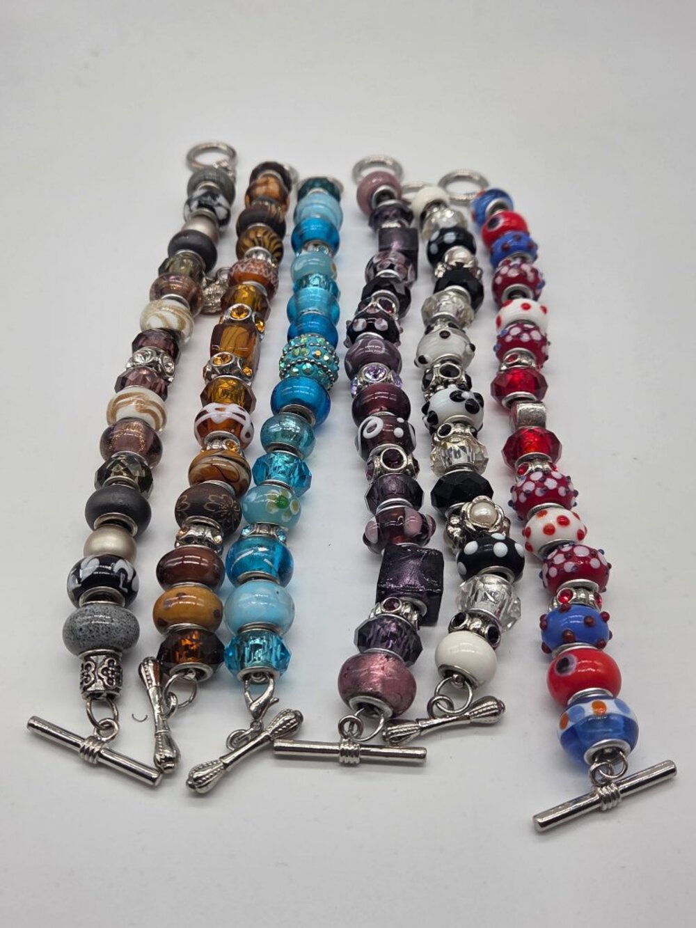 SIX unique Pandora style bead bracelets